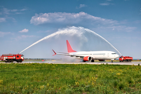 An inaugural flight receving a water salute at an airport as part of an air service development success